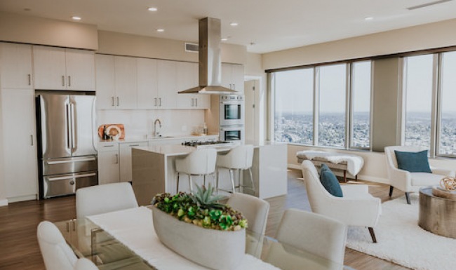 premium kitchen in light color scheme showing living & dining areas premium kitchen in light color scheme showing living & dining areas